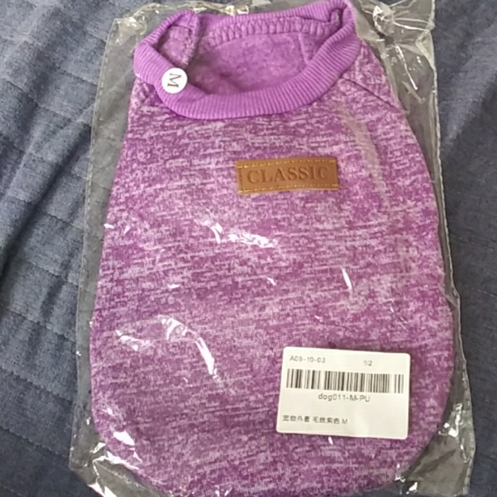 A purple jump suit and a great accessory